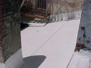 Roof surface is white due to white acrylic coating