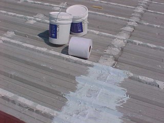 Pails of acrylic are lifted to the roof
