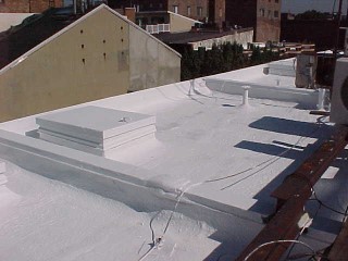 White acrylic applied to hatch cover and connection areas by Roof Menders